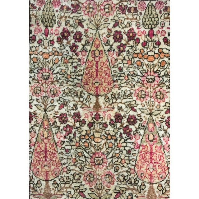 A gorgeous early 20th century Persian Lavar Kirman rug with three large cypress trees living amidst a densely populated...