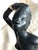 Beautiful vintage black female ceramic/chalkware figurine sculpture in a striking seated pose. I believe this piece dates...