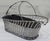 Elevate your entertaining with this handsome handmade silverplate wire wine basket, a beautifully crafted piece of...