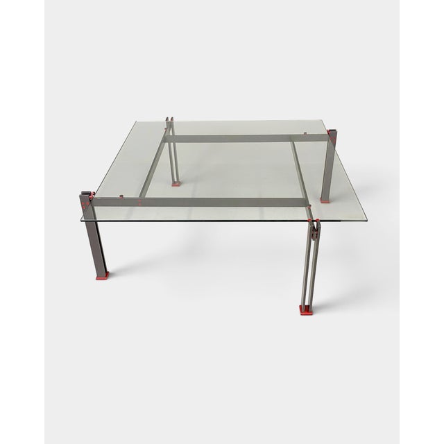 Original Italian coffee table from the 1980s, featuring a bold geometric construction characteristic of the Postmodern...
