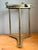 This distinctive vintage maritime accent table brings authentic nautical character to the interior with its brass...