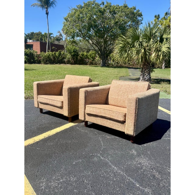 A handsome and highly collectible pair of Danish Modern lounge chairs, model GE 300, designed by Hans Wegner for Getama...