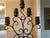 Decorative Accent Candelabra in scrolled distressed bronze that holds 5 3” pillar candles. 5 brown unlit candles included....
