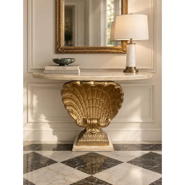 A dramatic vintage console table constructed in pine with sculptural plaster ornamentation, featuring an oversized scallop...