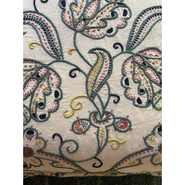 This is a set of two square decorative pillows with a blue floral design on a canvas background. The floral design is...