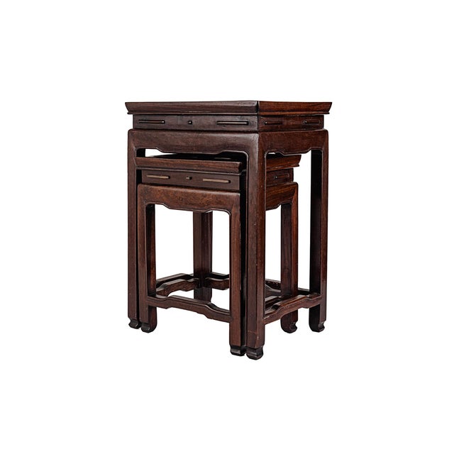 Set of 2 (two) Antique Chinese Rosewood Nesting Tables With Traditional Horse Hoof Feet. Mid-20th Century. Featuring a...