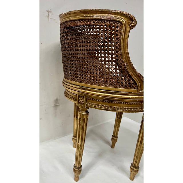 Louis xvi style armchair in giltwood seat and back with cane seat roped back carved with acanthus flowers and leaves four...