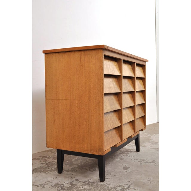 Chest of drawers with 15 drawers. Late 1930s / early 1940s. Originating from a school. The drawers feature slanted oak...