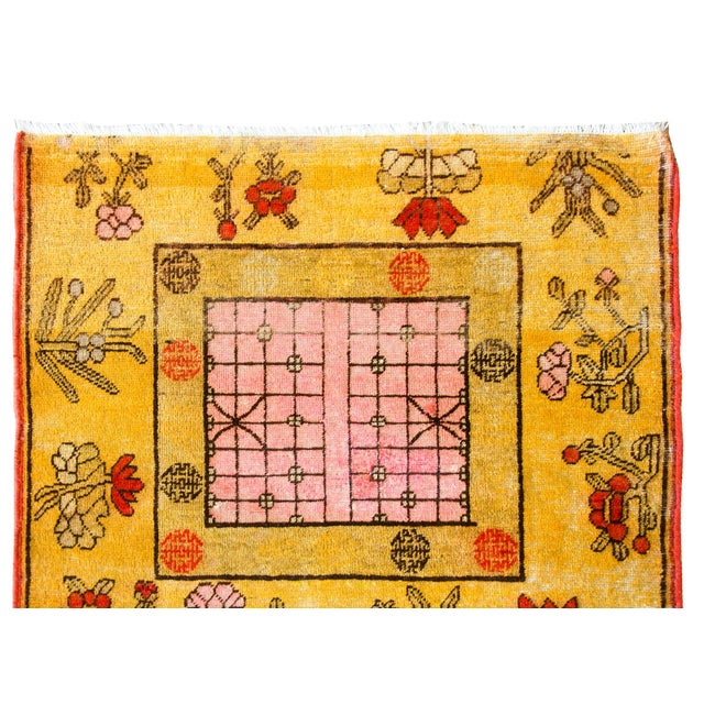A beautiful early 20th century Central Asian Samarghand rug with an unusual geometric patterned central square medallion...