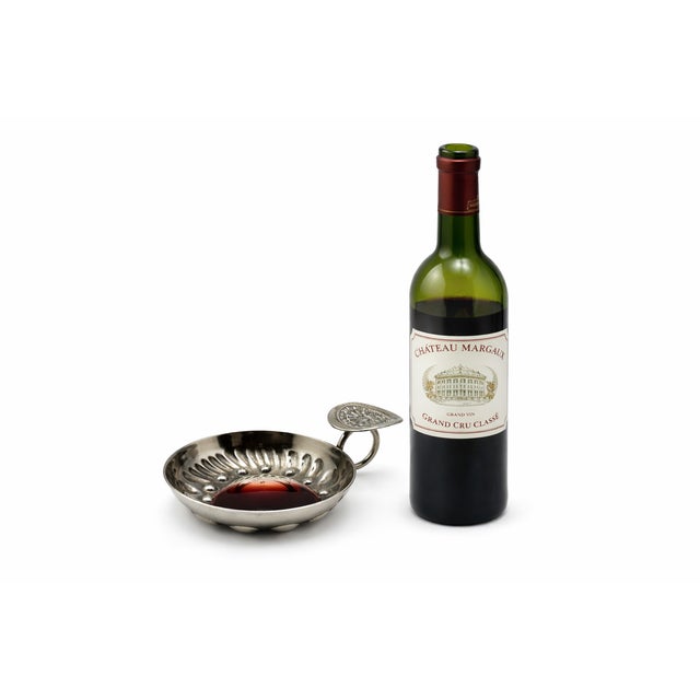 This antique French silver plate wine tasting cup, or tastevin, was designed by the Marc Parrod company specifically for...