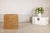 This large square vintage storage box is fully clad in tightly woven natural rattan, forming a clean, architectural cube....