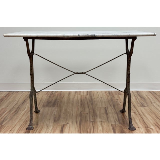 Vintage French style cast iron marble top bistro table with rectangular marble top. Stunning veining to marble with...