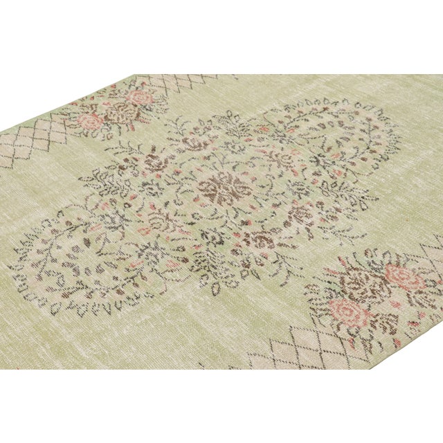 Hand-knotted in wool and originating from Turkey circa 1960 – 1970, this 5x9 vintage Zeki Müren rug is a unique addition...