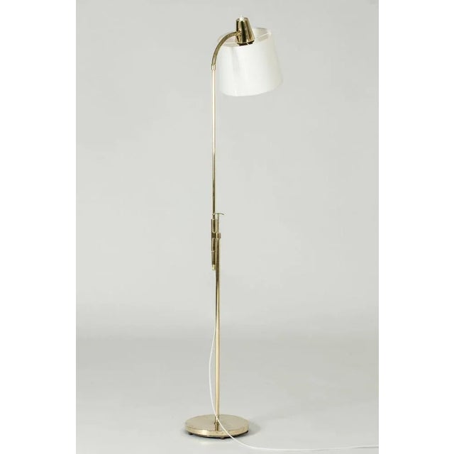 Neat Swedish Modernist brass floor lamp, with a flexible neck and adjustable height. European Plug (up to 250V).The wiring...