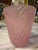 Elegant vintage Murano glass vase crafted in Italy during the 1970s, featuring a soft pink tone with beautifully twisted...