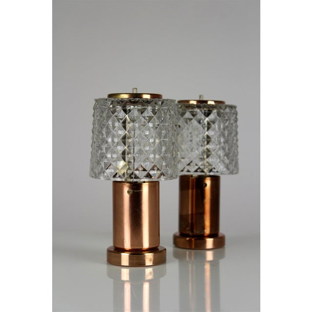 Pair of Czech table lamps produced in Kamenický Šenov, circa 1970s. Featuring faceted cut glass shades combined with...