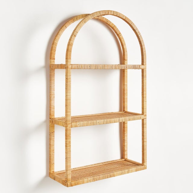 This 3tier rattan wrapped curio shelf with an arch design is a casual accent for the home or office. A dynamic look...