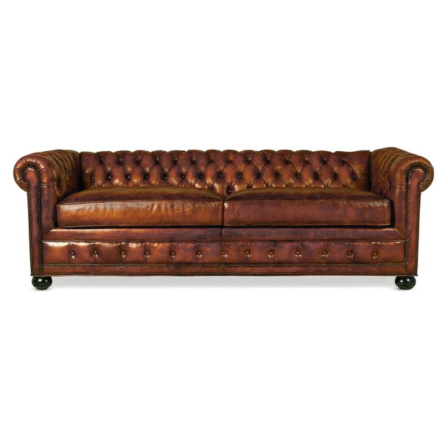 A classic antiqued leather sofa. This beautiful hand-rubbed and antiqued leather chesterfield sofa is expertly crafted and...