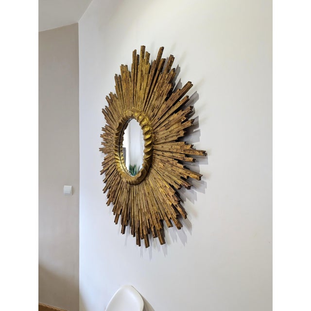 Large Sun Mirror in Carved and Gilded Wood, 1950s, in Good conditions. Designed 1950 to 1959