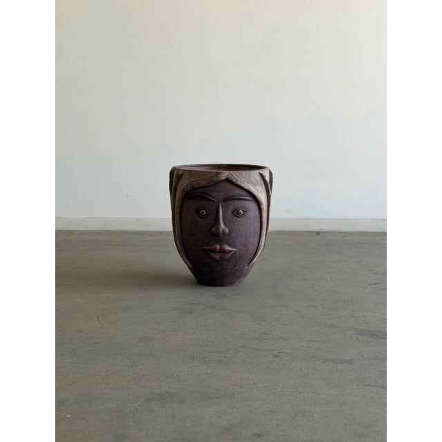 W15.5 D15.5 H17.5 A striking vintage Mexican terracotta planter featuring a beautifully sculpted face with expressive...
