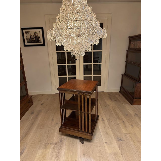 A magnificent antique mahogany revolving bookcase of exceptional quality, crafted by the renowned 19th-century English...