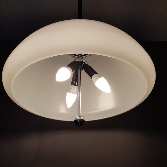 Space age pendant lamp by luigi massoni for guzzini, made in italy in the 70s. extra large plastic shade in white. The...