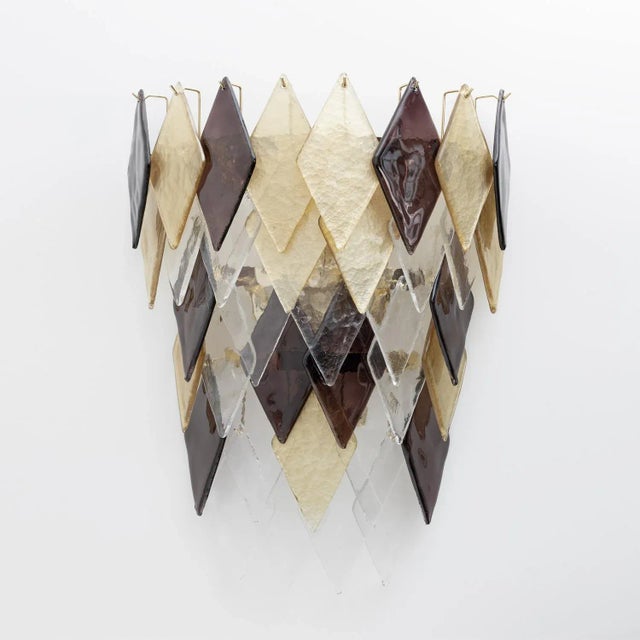 Pair of wall lamps, each composed of 35 gold, brown and transparent Murano blown glass rhombuses. The lamps have six E14...