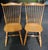 Beautiful pair of solid maple windsor chairs by Dinaire of Buffalo, NY. These chairs are Fan Back design with comfortable...