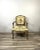 This beautiful mid-century copy of a Louis XV style chair offers a bit a nostalgia and the sturdiness of a newer chair....