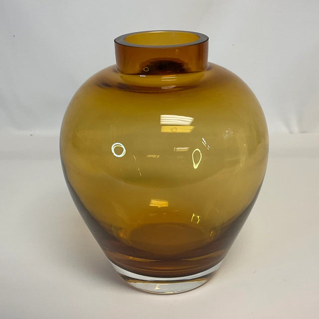 Sometimes the simplicity of design is stunning. That’s the case with this smooth Handblown glass vase. Its design allows...