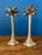 A sculptural pair of vintage brass candlesticks in the form of stylized palm trees, with textured bases, segmented trunks,...