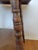 Antique square oak parlor, lamp, or occasional table dating to the early 20th century. The design combines a substantial...