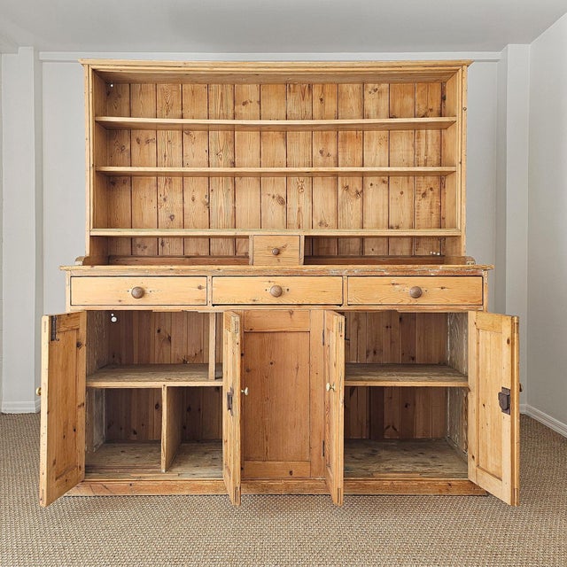 A beautiful antique English pine dresser, offering generous storage and timeless country charm. Crafted in two pieces,...