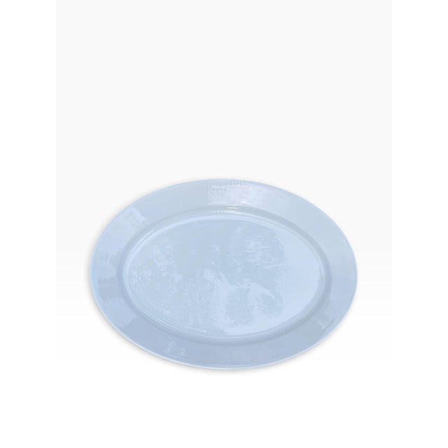 A rare and exceptionally large mid-century modern oval ceramic serving platter manufactured by Arabia Finland. Featuring a...