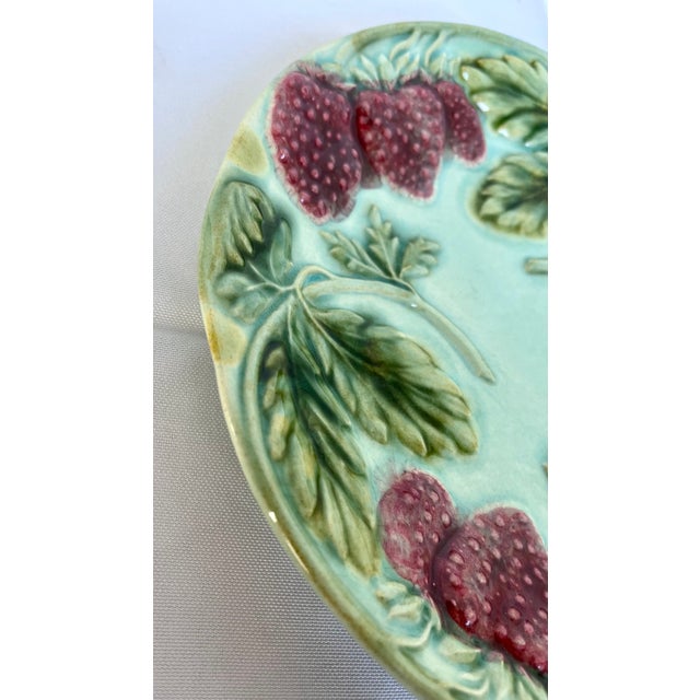 Made in France. Antique majolica strawberry plate with heavy relief fruit and foliage. Beautiful color palette of greens...