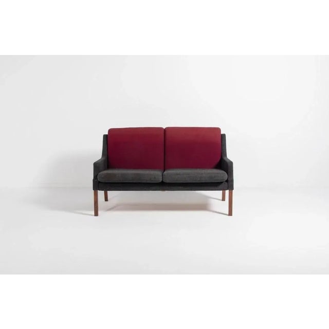 A beautiful two seats sofa designed in the 1960s by Rud Thygesen and produced by Vejen Polstermøbelfabrik. The sofa is...