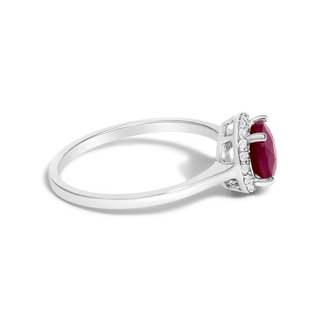 Adorn your hand with the splendor of rich, velvety red captured in a mesmerizing 6x6 mm ruby, its fiery hues deepened...