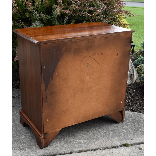Vintage: (1970's) Bachelors Chest has a Chippendale Style. The Wood is Solid Cherry. The Chest has Four Drawers, Pull-Out,...