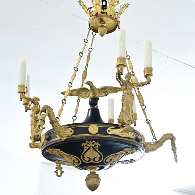 French, 19th century Empire style ceiling fixture of black tôle using six candelabra lights to illuminate the stunning...