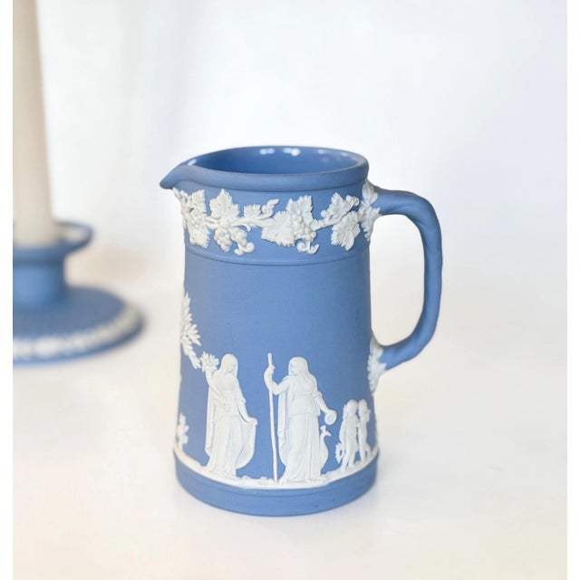 Beautiful vintage Wedgwood Jasperware pitcher in the classic "Wedgwood blue" with cream reliefs depicting classical Greek...