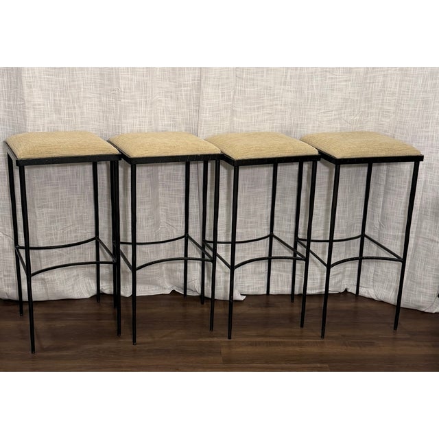Elevated and architectural, this set of four hammered steel counter stools by Global Views blends clean modern lines with...
