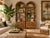 Beautiful pair of vintage Palm Beach Regency étagères featuring elegant arched tops, intricate woven rattan detailing, and...