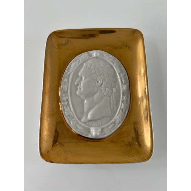 Rare Vintage Fornasetti trinket tray made for Rosenfeld Imports. Cesar like profile is raised on a beautiful gold trim.