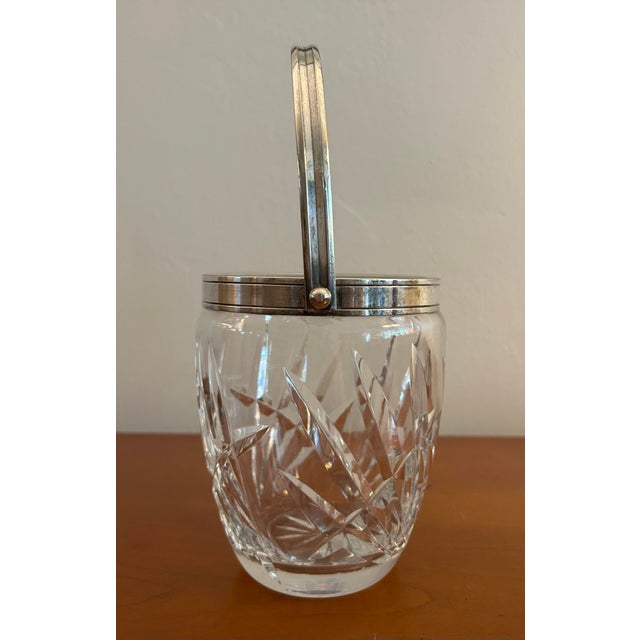 Vintage cut crystal small ice bucket with silver plated collar and swing handle. Deep geometric cut classic pattern....
