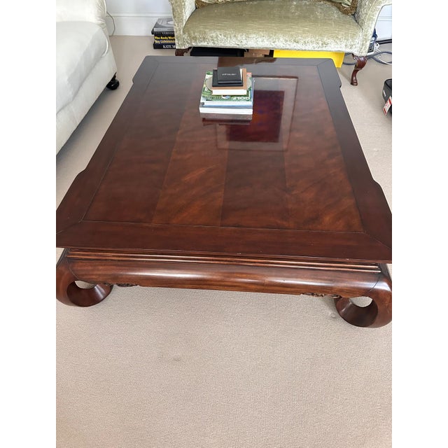 The elegant silhouette of Ralph Lauren’s Beekman cocktail table is enhanced by artful hand-carved details, including an...