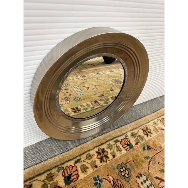 Design Plus Gallery presents a Porthole Mirror of Stainless Style. This type of mirror has the shape and illusion of a...