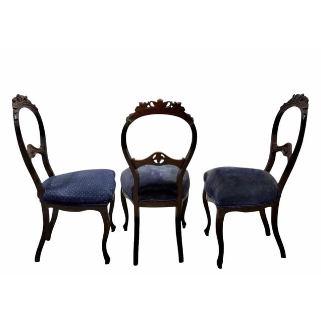 Set of 3 Victorian Carved Balloon-Back Side Chairs A set of three Victorian Victorian-style carved wood side chairs...