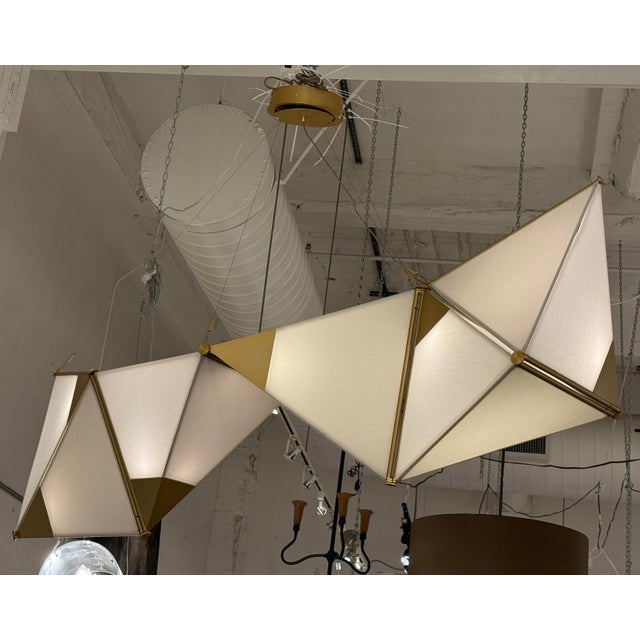 Design Plus Gallery presents the Ketta Light Fixture from James Dieter. The ketta chandelier is a chain of pyramidal...