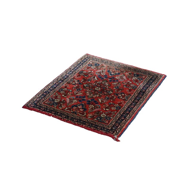 Vintage oriental wool area rug. showcases a classic floral design from the early 20th century. The compact textile...
