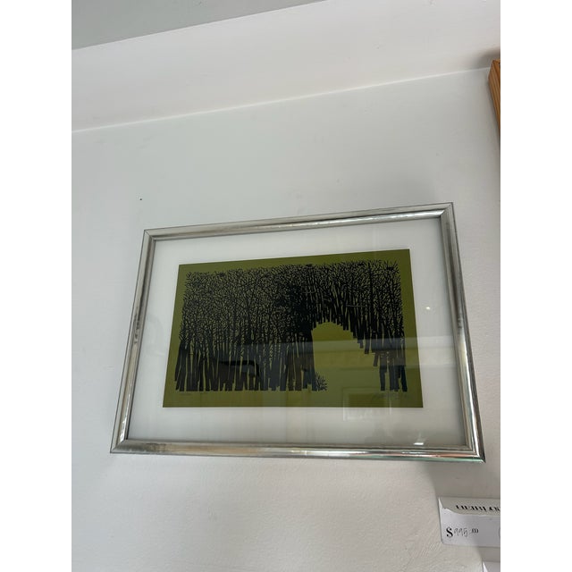 Vintage Antonio Frasconi woodcut printed on green paper, presented in a new silver and wood frame with float detail. The...